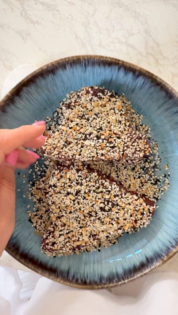 Asian sesame-crusted tuna with garlic ginger dressing and summer vegetable salad