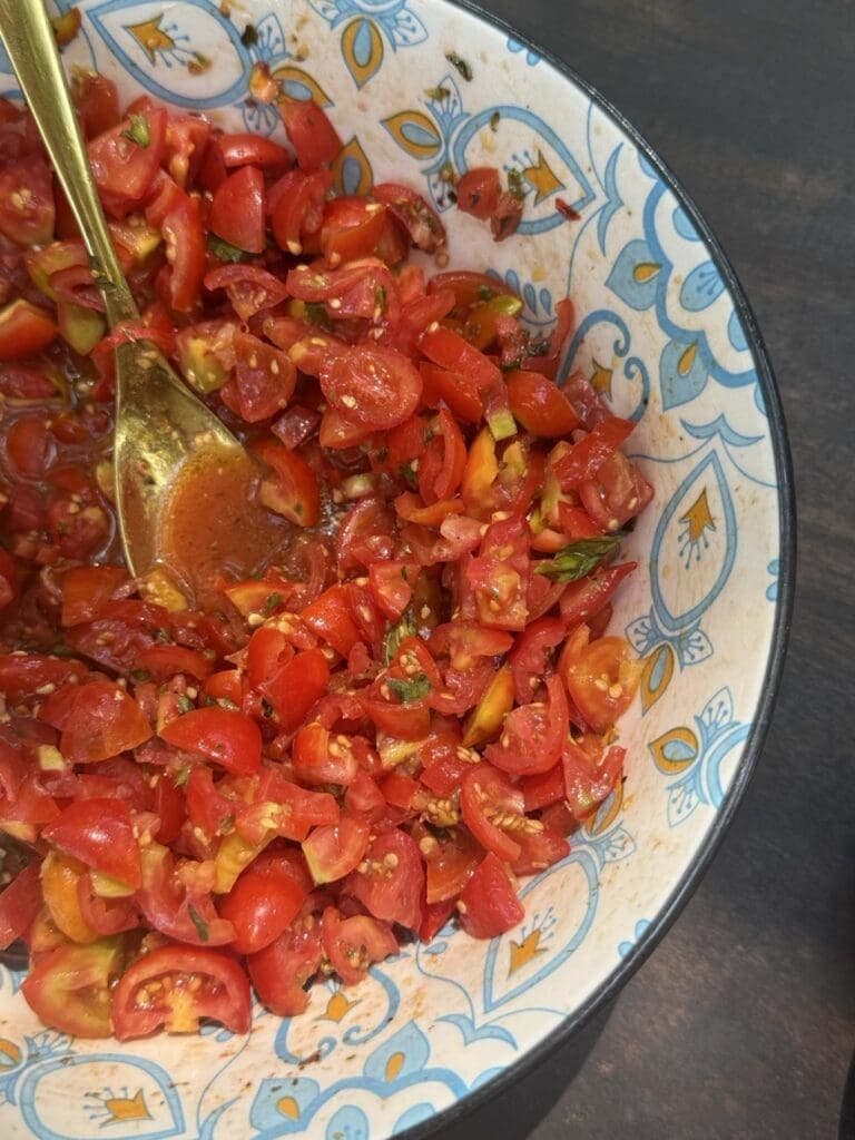 Simple tomato salad, an example of how travel influences cooking by teaching restraint and the beauty of three perfect ingredients.