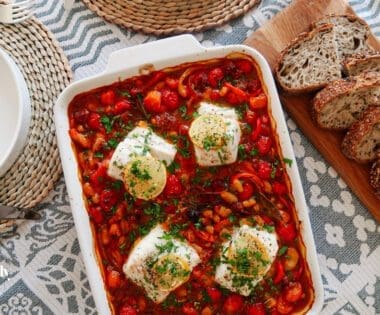 baked cod with chorizo served with crusty bread overhead