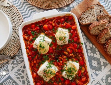 baked cod with chorizo served with crusty bread overhead