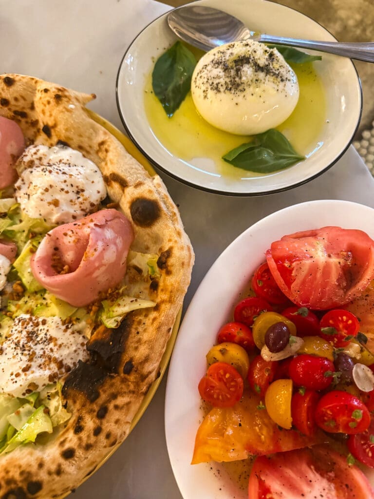 Signature courgette, stracciatella and mortadella pizza at Rikito – essential stop when deciding where to eat in Palma