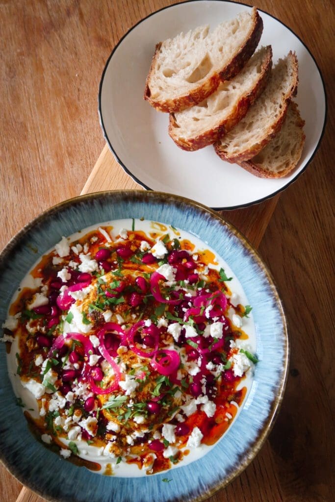 Turkish eggs served with pickled onions, feta and sourdough toast