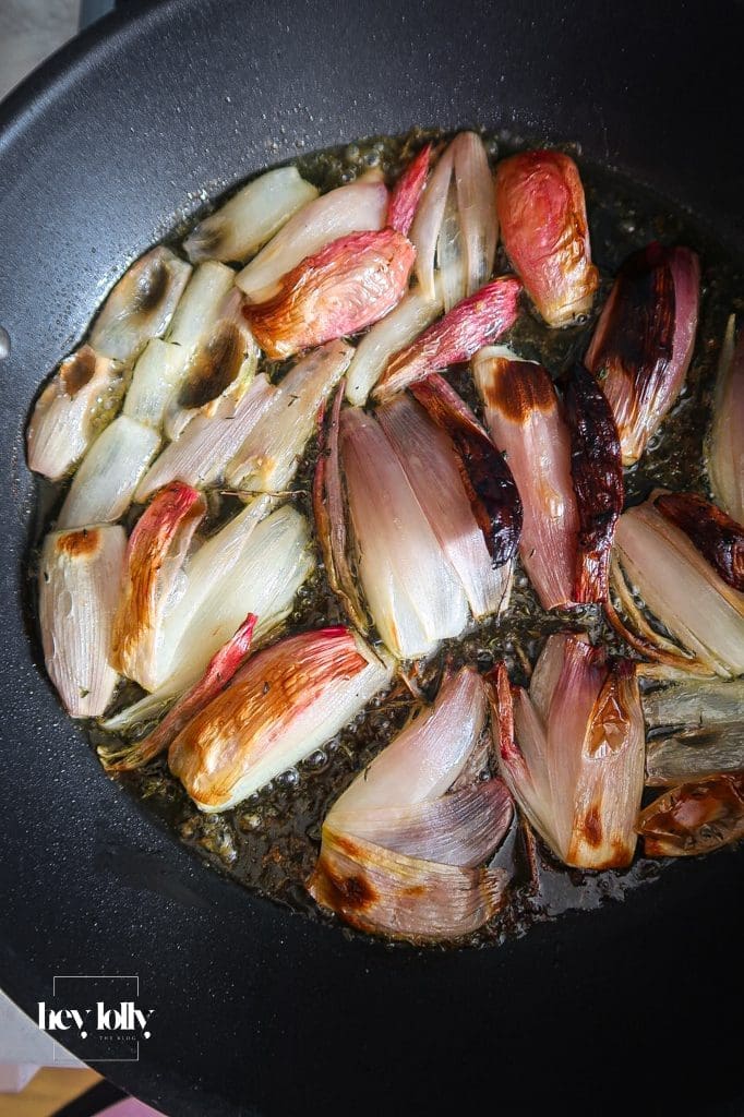 Pan of shallot and tomato tart just flipped and cooling