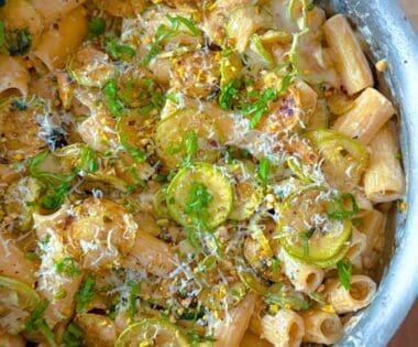 overhead shot of courgette lemon ricotta rigatoni pasta