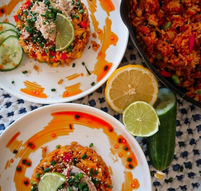 Korean Crab Fried Rice in a ceramic bowl with lime and herbs