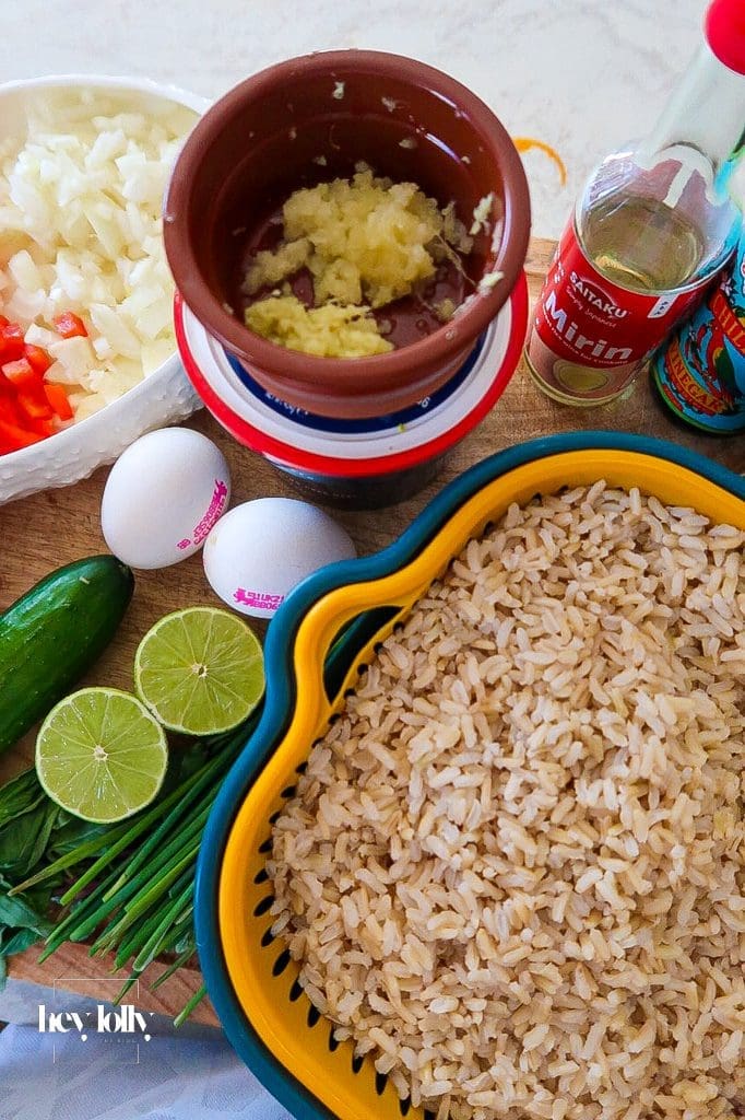 Ingredients for Korean Crab Fried Rice: day-old brown rice, gochujang, crab, lime, herbs.