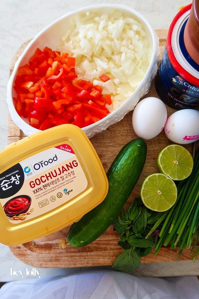 Ingredients for Korean Crab Fried Rice: day-old brown rice, gochujang, crab, lime, herbs.