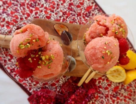 Close-up of no-churn nectarine and passion fruit sorbet, served with passion fruit pulp