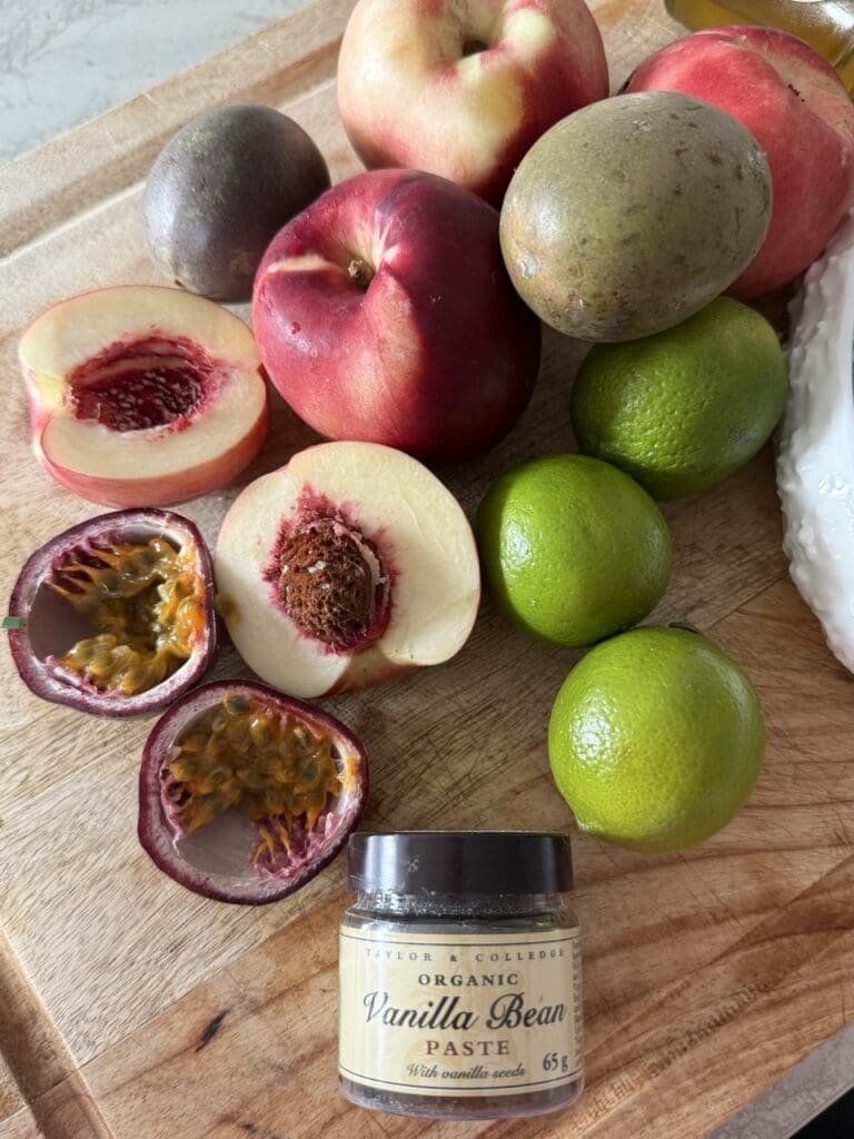Overhead shot of fresh nectarines, passion fruits, limes, sugar and honey ready to make nectarine and passion fruit sorbet
