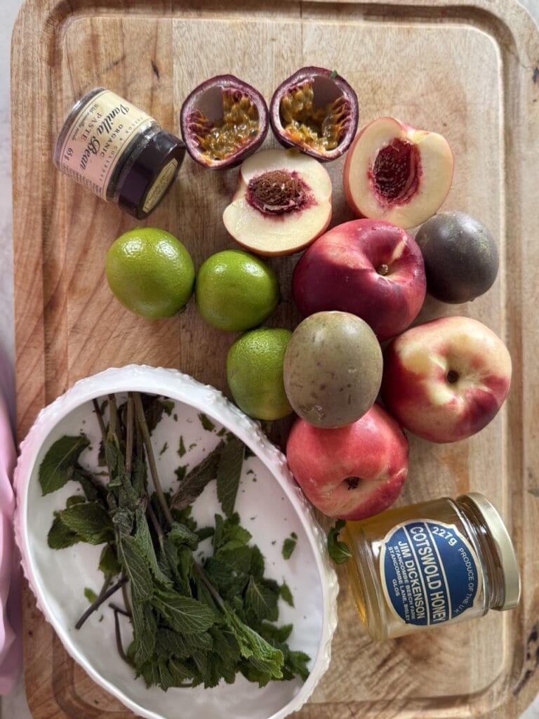 Overhead shot of fresh nectarines, passion fruits, limes, sugar and honey ready to make nectarine and passion fruit sorbet