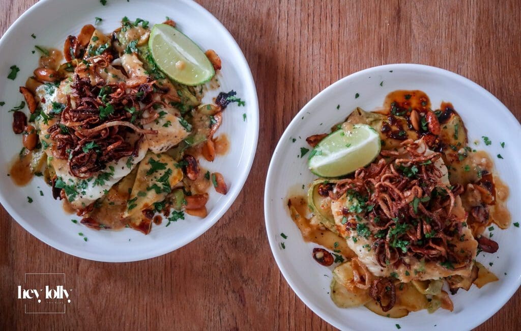 Plated miso butter cod with sesame courgette noodles and crispy shallots