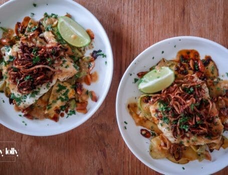 Plated miso butter cod with sesame courgette noodles and crispy shallots