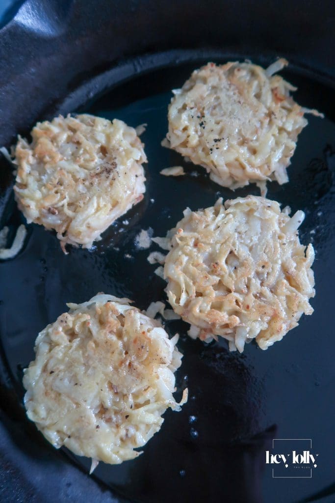 Golden potato cakes sizzling in a pan of hot oil.