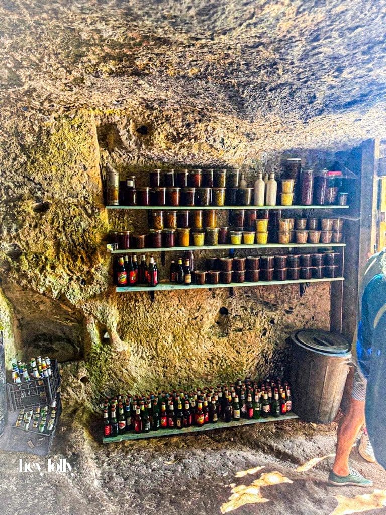 Shelves stocked with Sicilian ingredients and preserves at Slow Life Family Farm near Siracusa.