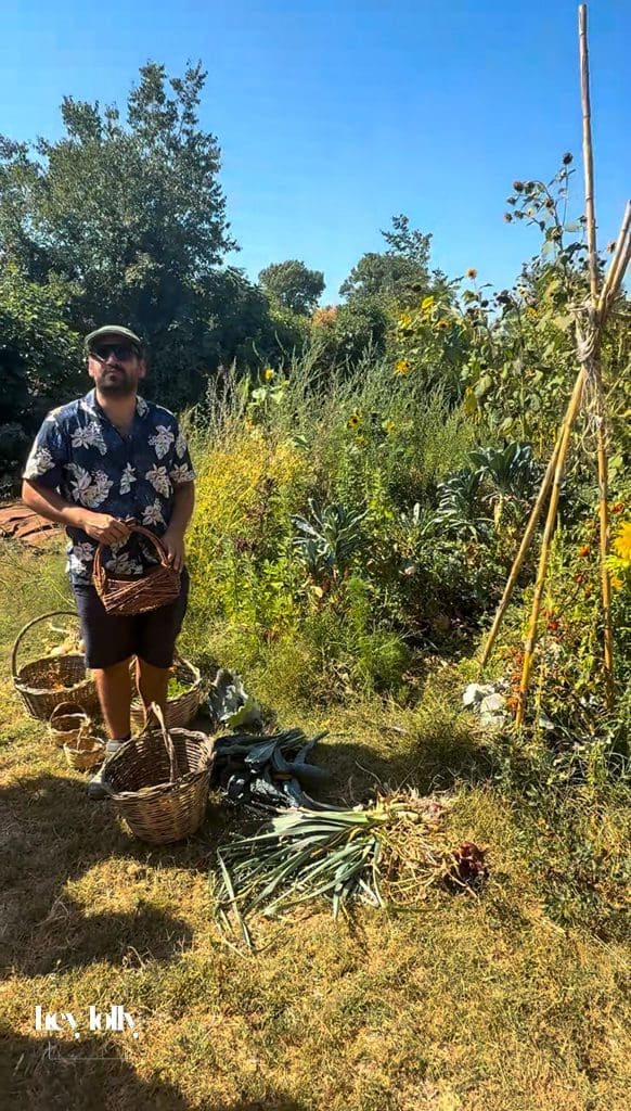 Carlo talking us through the harvesting process at slow life family farm sicialian cooking class in siracusa