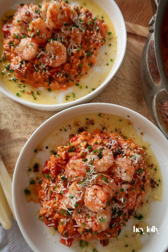 Close-up of king prawn tomato risotto with mascarpone creaminess and fresh herbs