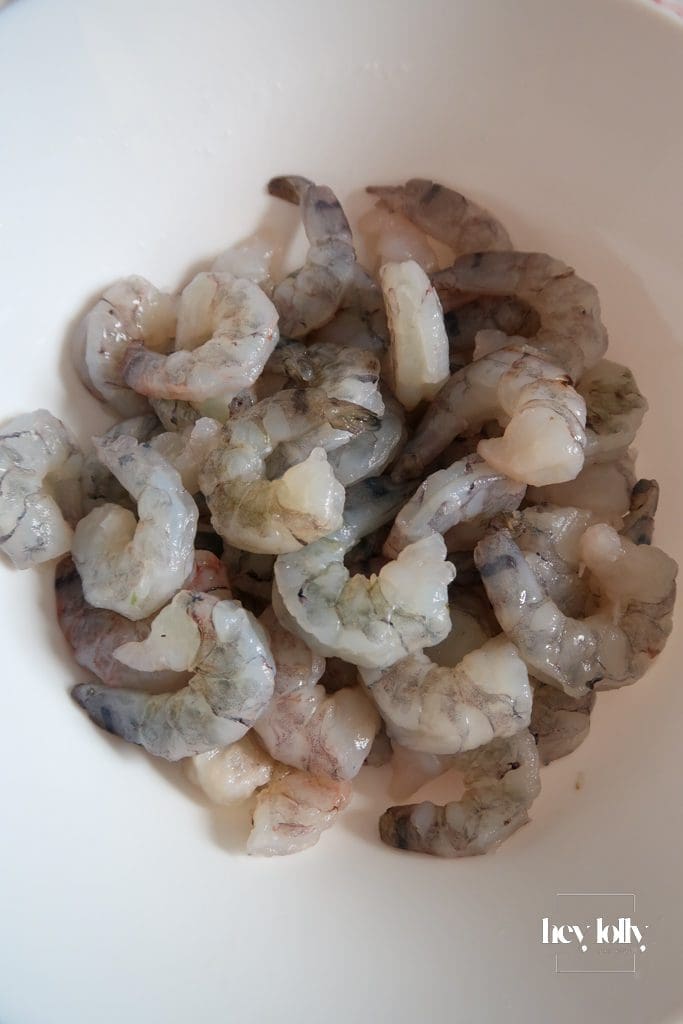 Fresh ingredients for king prawn tomato risotto including prawns shrimp