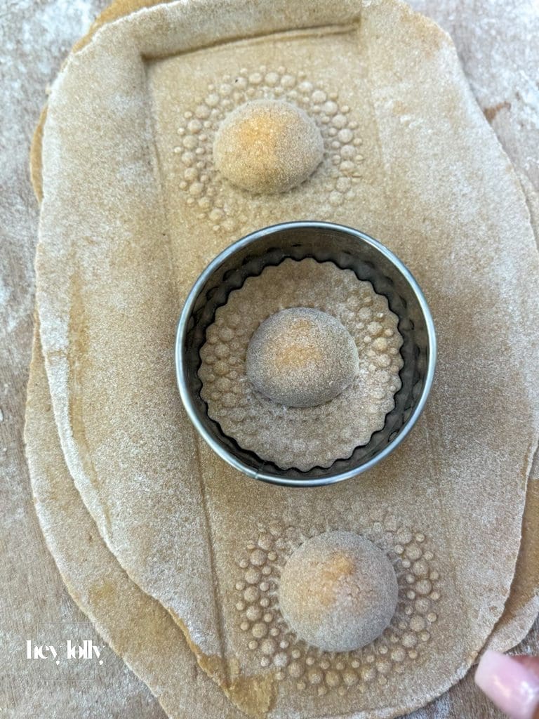 Close-up of ravioli being sealed and prepared in the outdoor kitchen in Sicily.