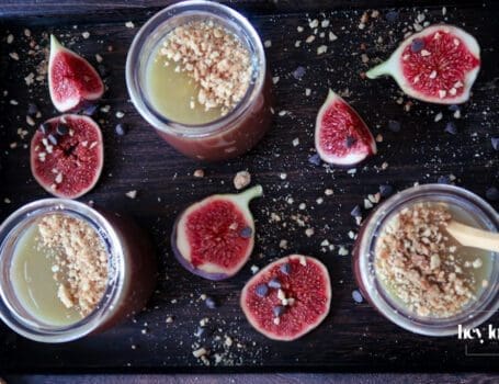 Salted Caramel Chocolate Pots served in small glasses, topped with glossy caramel and sea salt flakes.