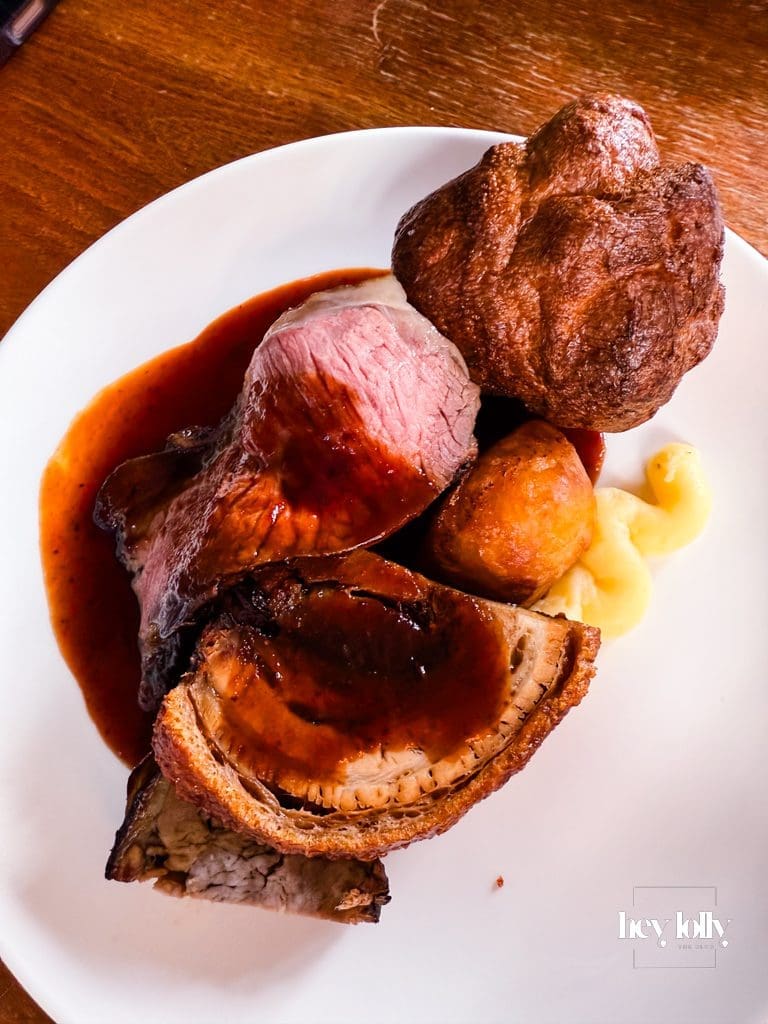 Trio of roast meats — beef, pork, and lamb — with roast potatoes, Yorkshire pudding, and seasonal vegetables, Sunday lunch Nottingham at The Griffin