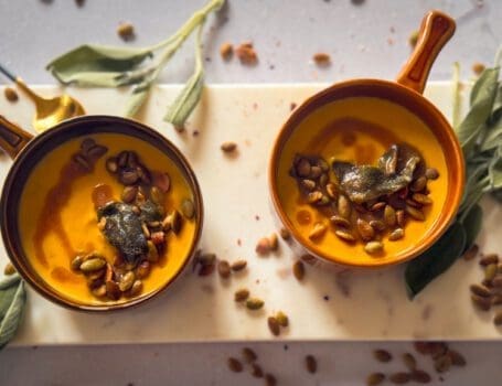 Bowls of Butternut Squash Soup with Sage Brown Butter, crisp sage and toasted pumpkin seeds