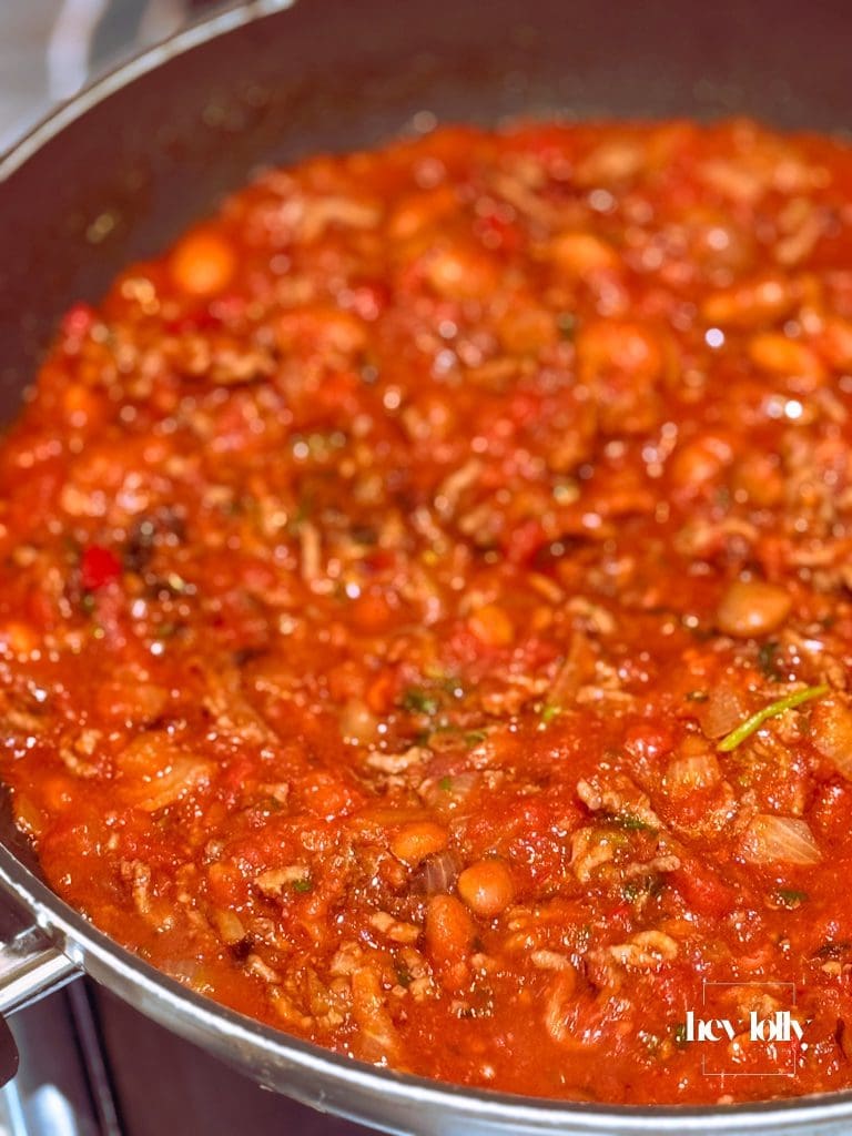 Thick, glossy Sloppy Joe sauce reducing to a sticky finish.