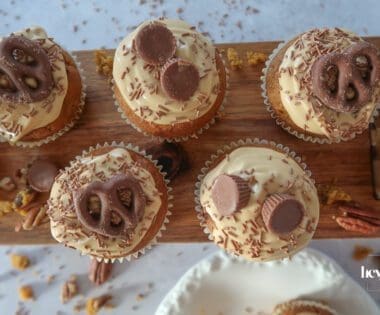 Pumpkin, Maple & Pecan Muffins topped with burnt-butter caramel cream cheese swirls.