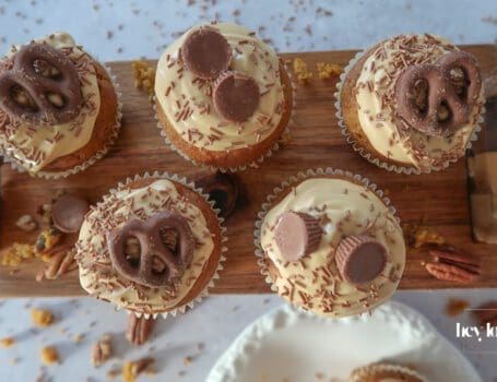 Pumpkin, Maple & Pecan Muffins topped with burnt-butter caramel cream cheese swirls.