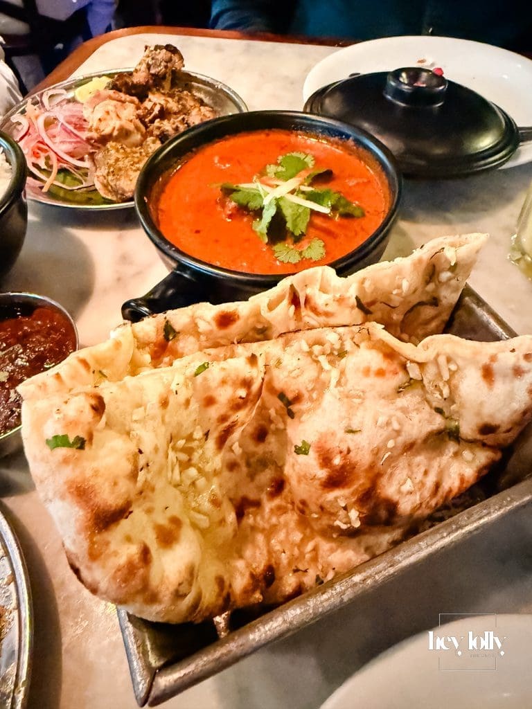 Indian sharing dishes on a small table at Dishoom Shoreditch