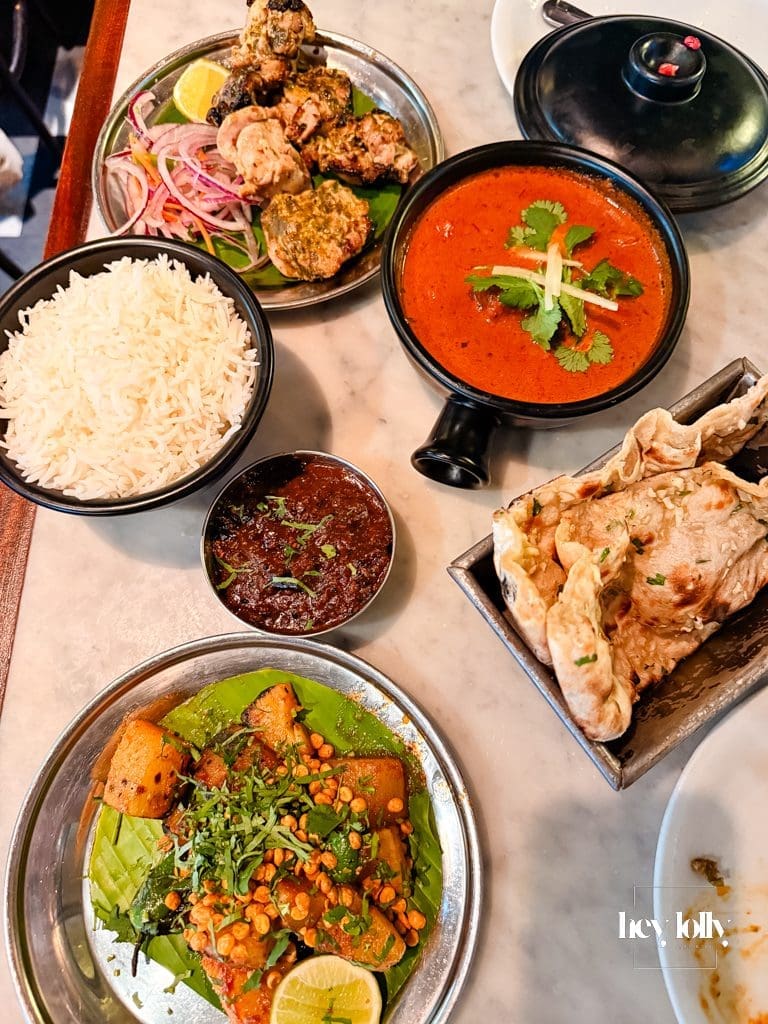 Table spread of dishes during a Dishoom Shoreditch review visit
