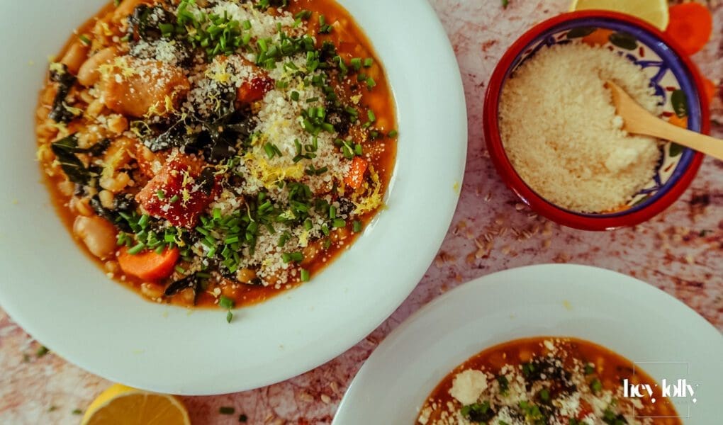 oven on world off pearl barley stew overhead shot in white bowls with grated parmesan and lemon zest