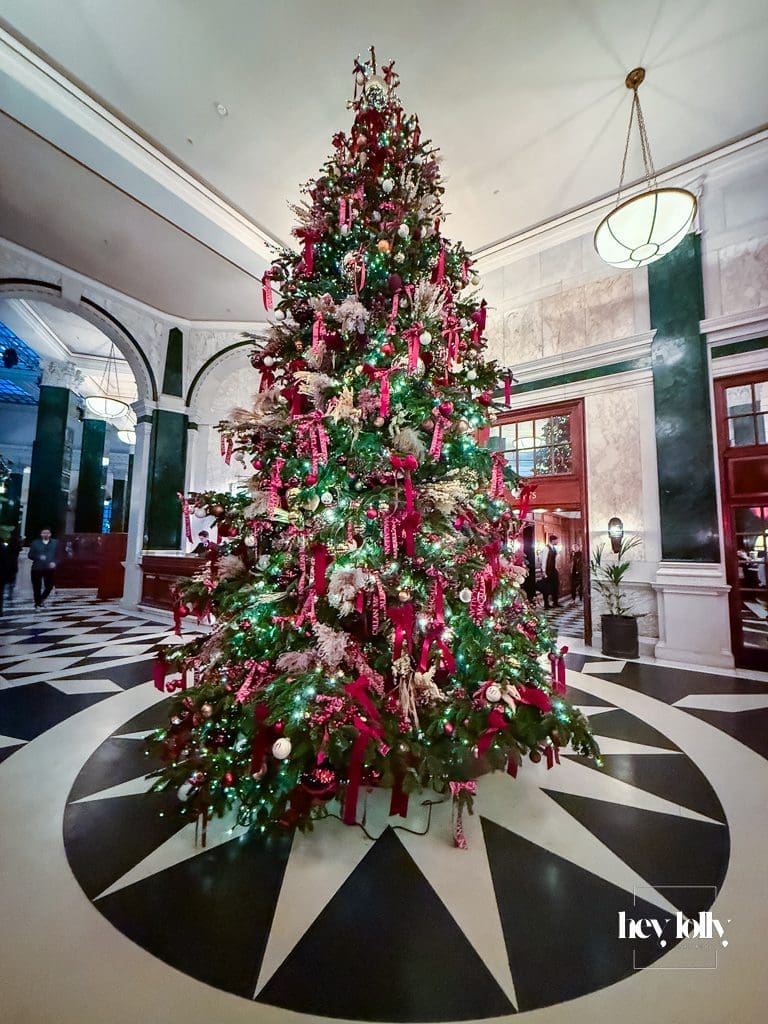 Grand entrance hall at The Ned London decorated for Christmas