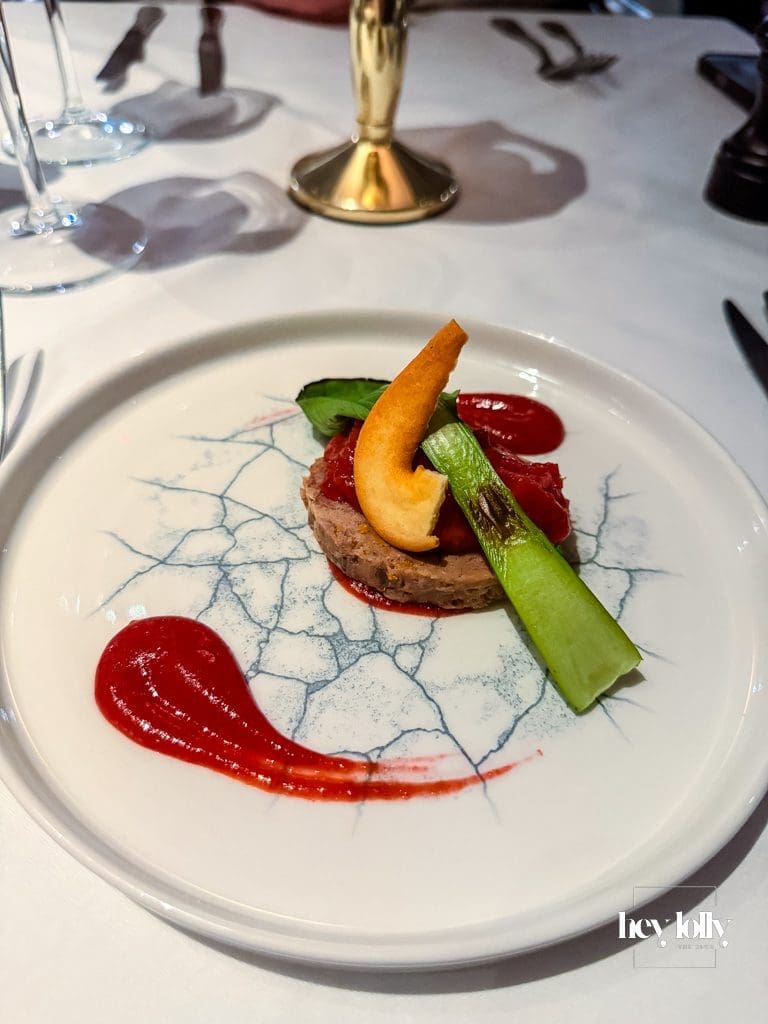 Confit duck terrine with plum gel, mandarin and baby pak choi