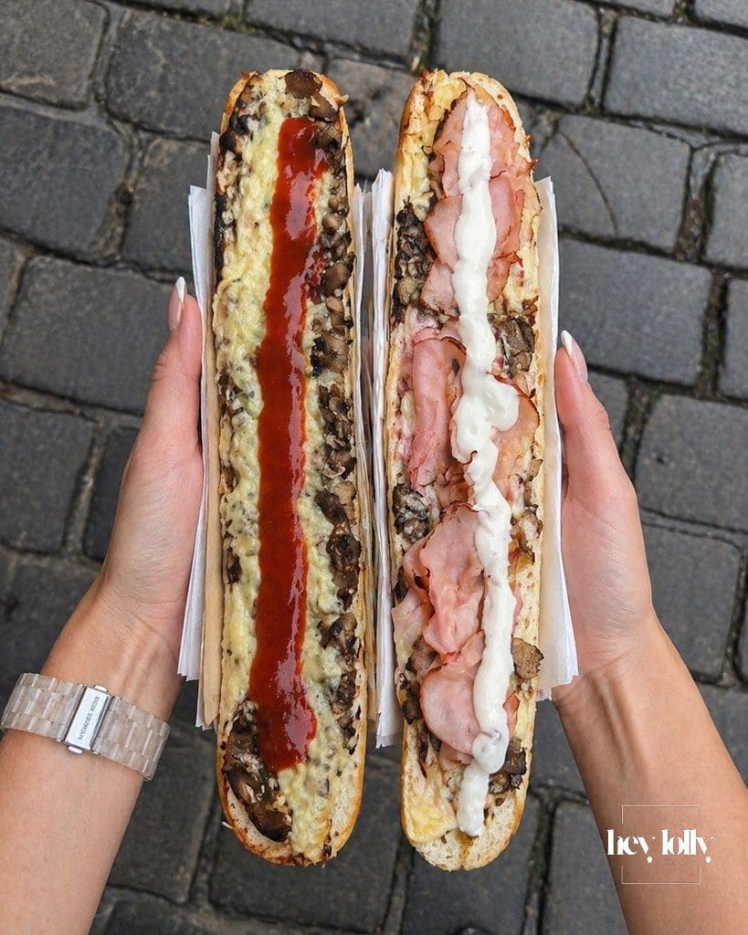 Two classic zapiekanki in Krakow with mushrooms cheese ketchup and garlic sauce