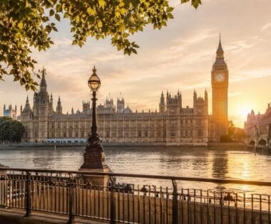 Golden hour view across the River Thames towards Big Ben and the Houses of Parliament for first-time visitors planning the best London tours.