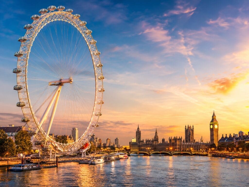 London Eye entry ticket tour image showing the iconic observation wheel beside the River Thames with Westminster views in London.