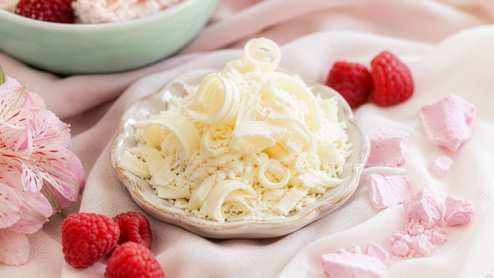 Shaved white chocolate curls for raspberry whip